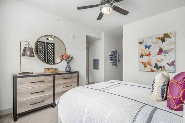 Peak 83: Cozy bedroom with modern decor in Greystar luxury apartments