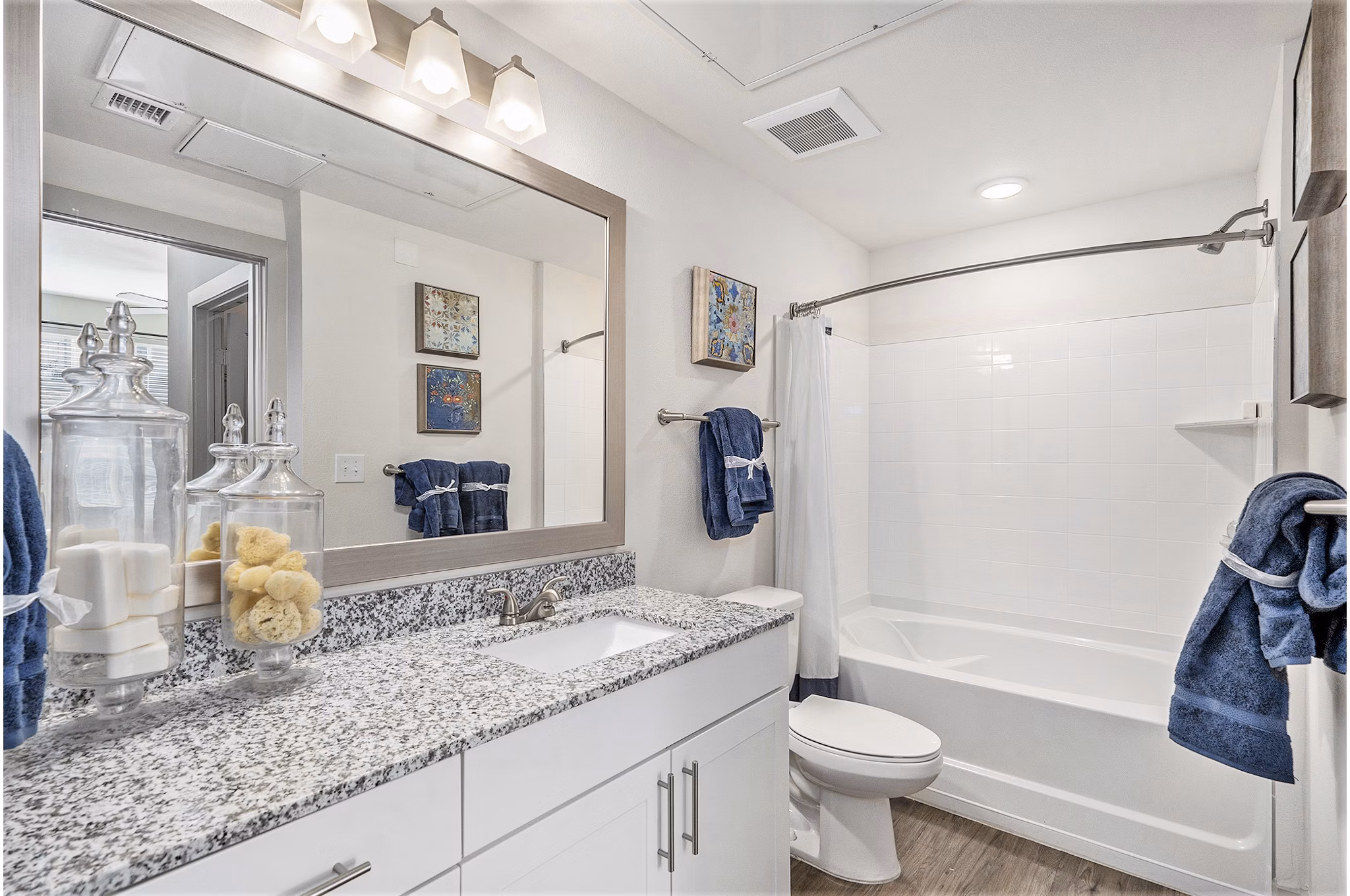 Elegant bathroom featuring modern fixtures and double vanities at Peak 83 luxury apartments