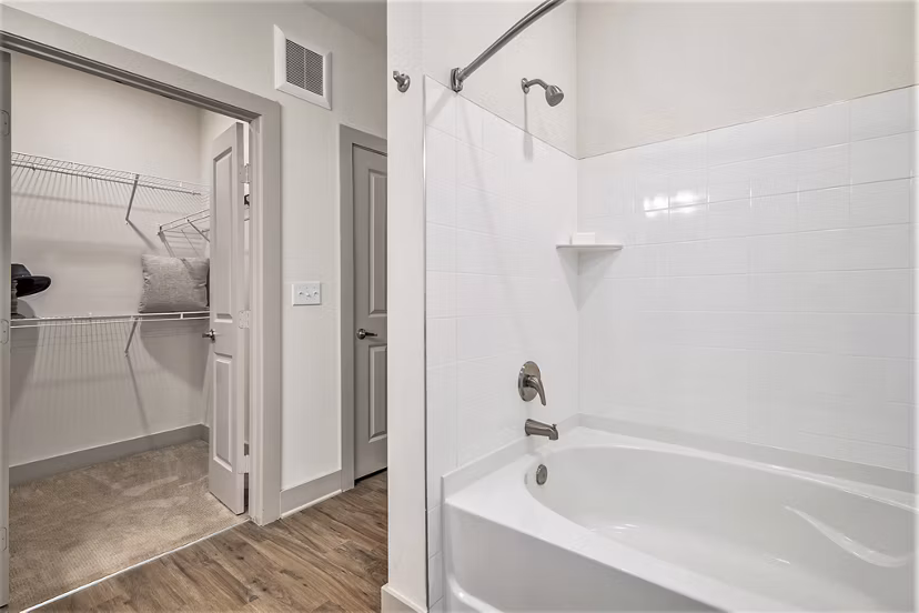 Modern bathroom with sleek fixtures and marble countertops in Peak 83 luxury apartments