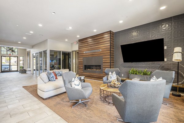 Modern clubhouse featuring stylish decor and seating at Peak 83 luxury apartments