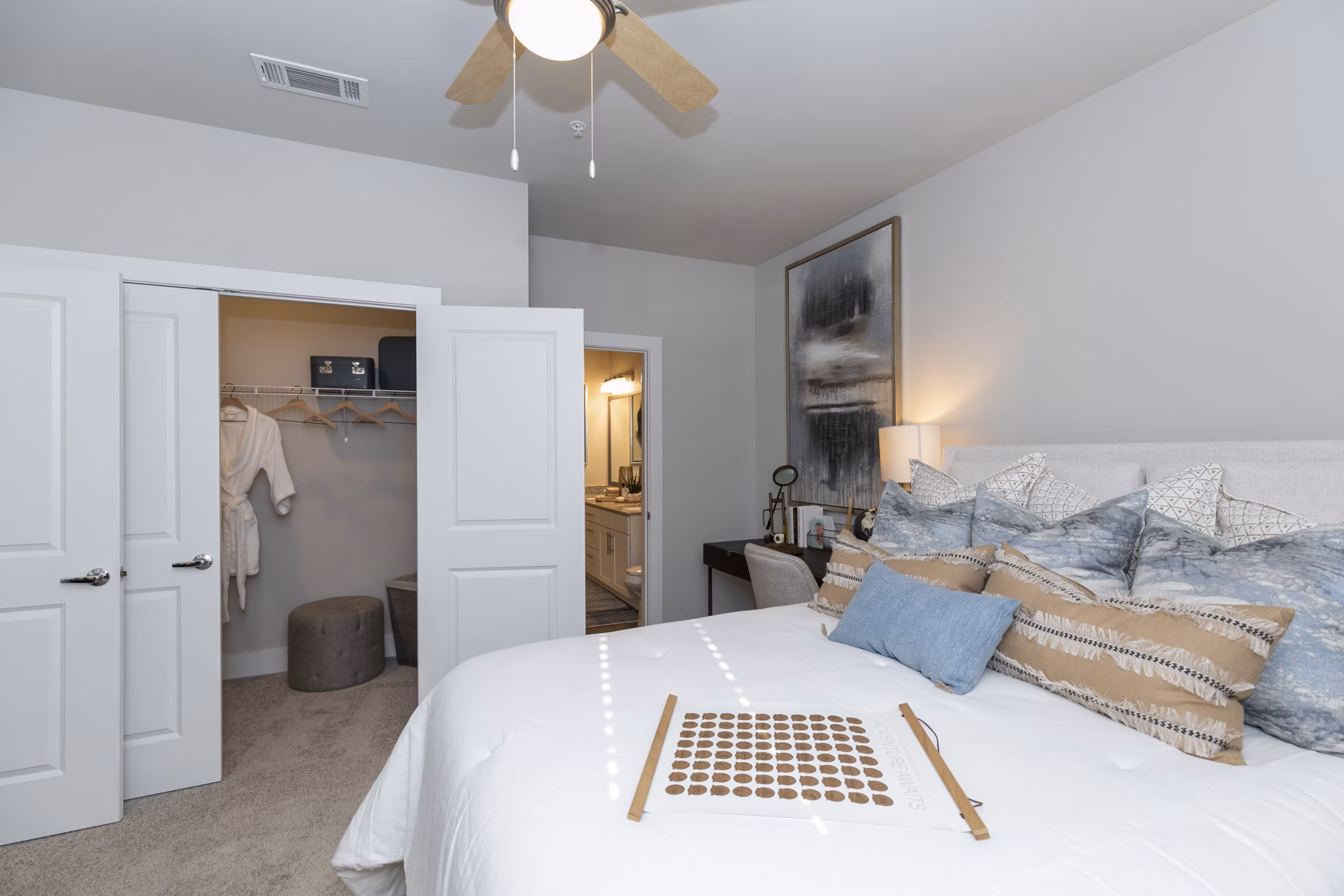 Cozy bedroom with modern decor at Annabelle on Main Apartments