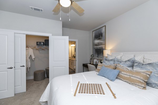 Cozy bedroom with modern decor at Annabelle on Main Apartments