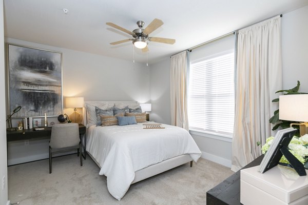 Cozy bedroom with elegant decor at Annabelle on Main Apartments offering luxury living