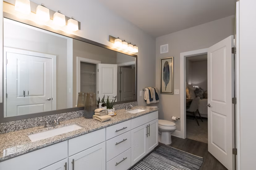 Modern bathroom with marble fixtures at Annabelle on Main Apartments, providing a luxurious living experience in a Greystar community