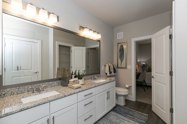 Modern bathroom with marble fixtures at Annabelle on Main Apartments, providing a luxurious living experience in a Greystar community