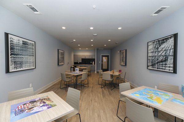 Clubhouse with modern design and seating area at Annabelle on Main Apartments