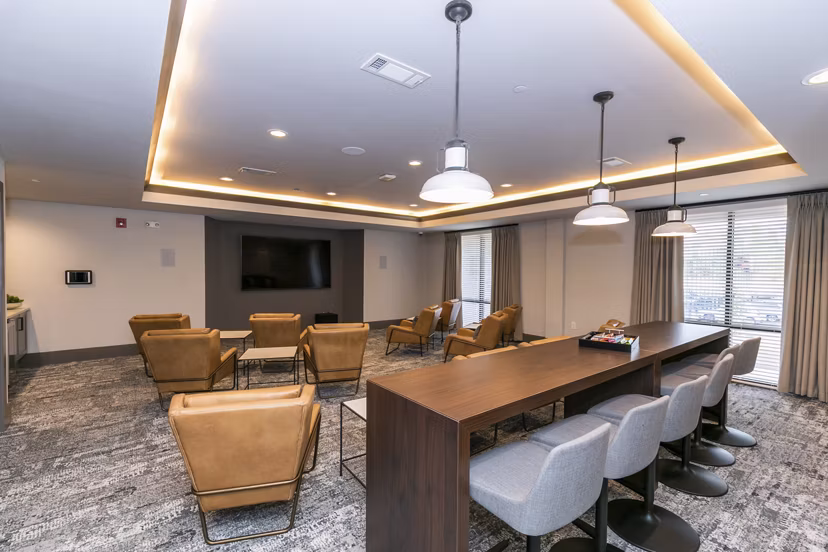 Theater room with plush seating at Annabelle on Main Apartments, offering luxury entertainment space