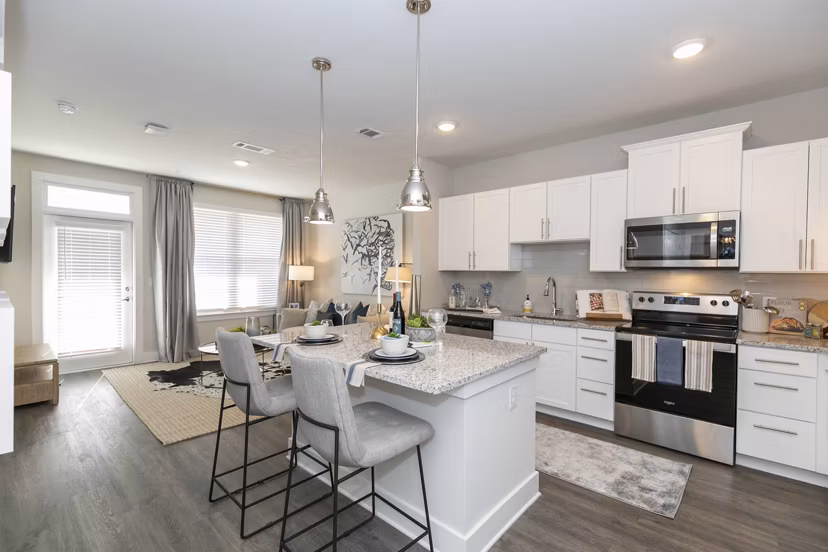 Modern kitchen with stainless steel appliances at Annabelle on Main Apartments
