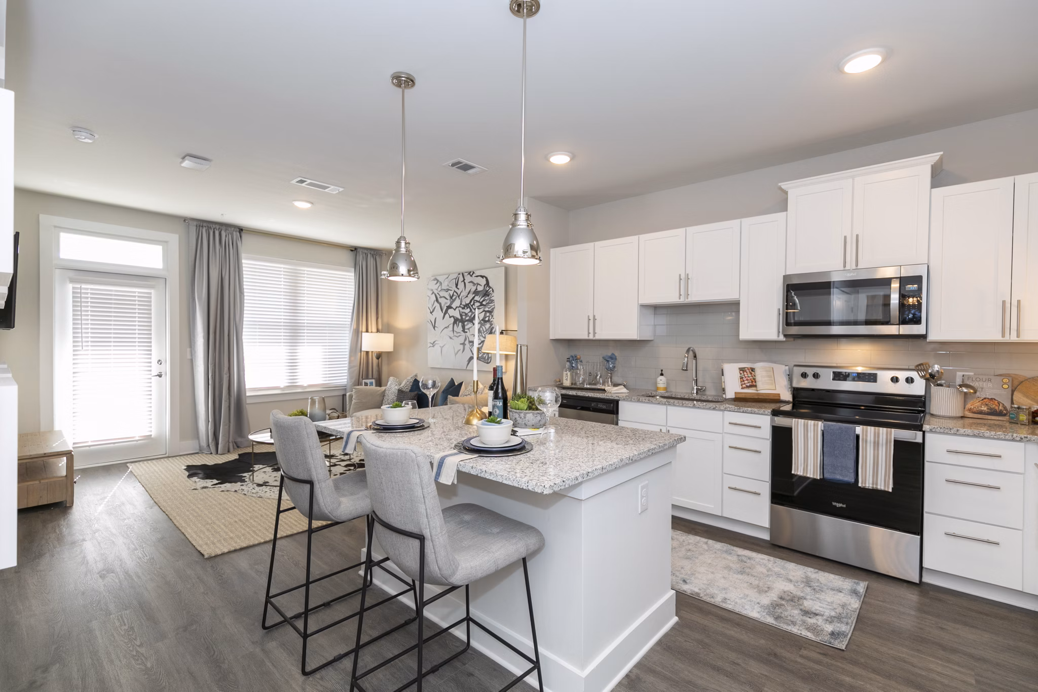 Modern kitchen with stainless steel appliances at Annabelle on Main Apartments