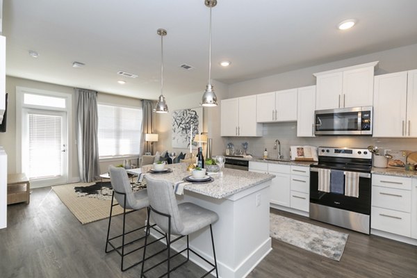 Modern kitchen with stainless steel appliances at Annabelle on Main Apartments