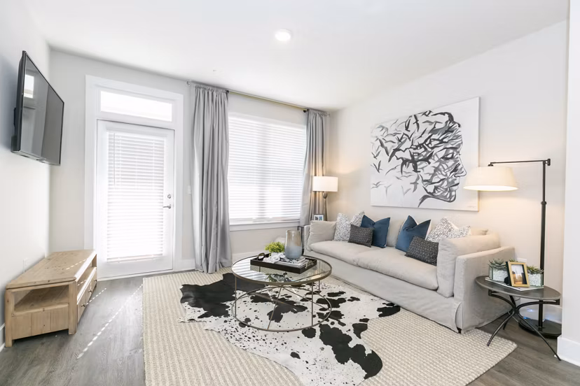 Spacious living room with modern decor in Annabelle on Main Apartments