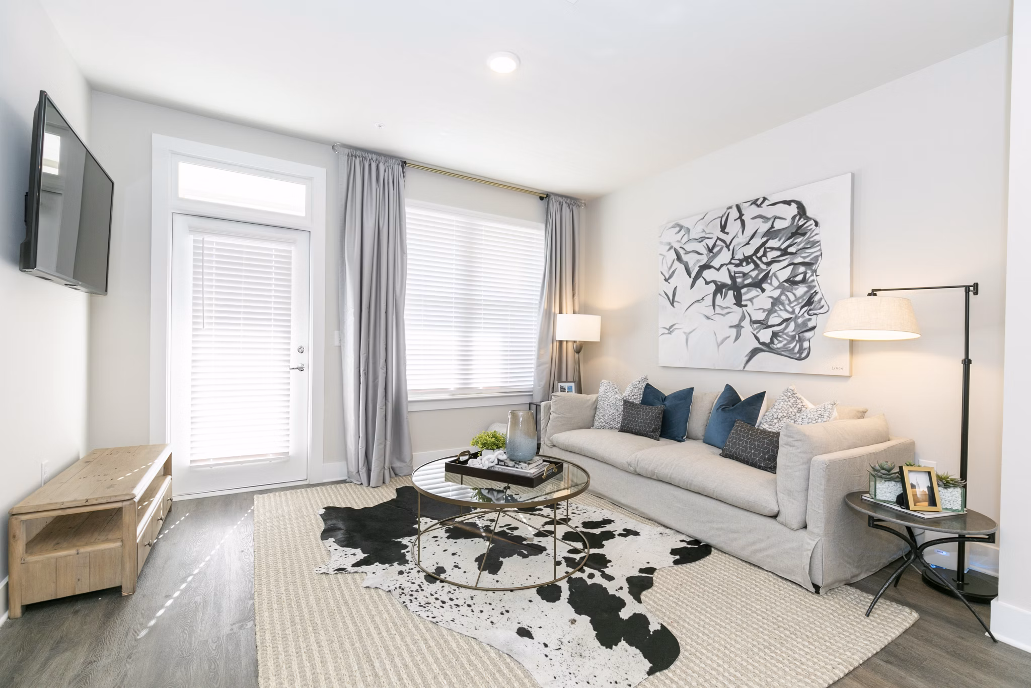 Spacious living room with modern decor in Annabelle on Main Apartments