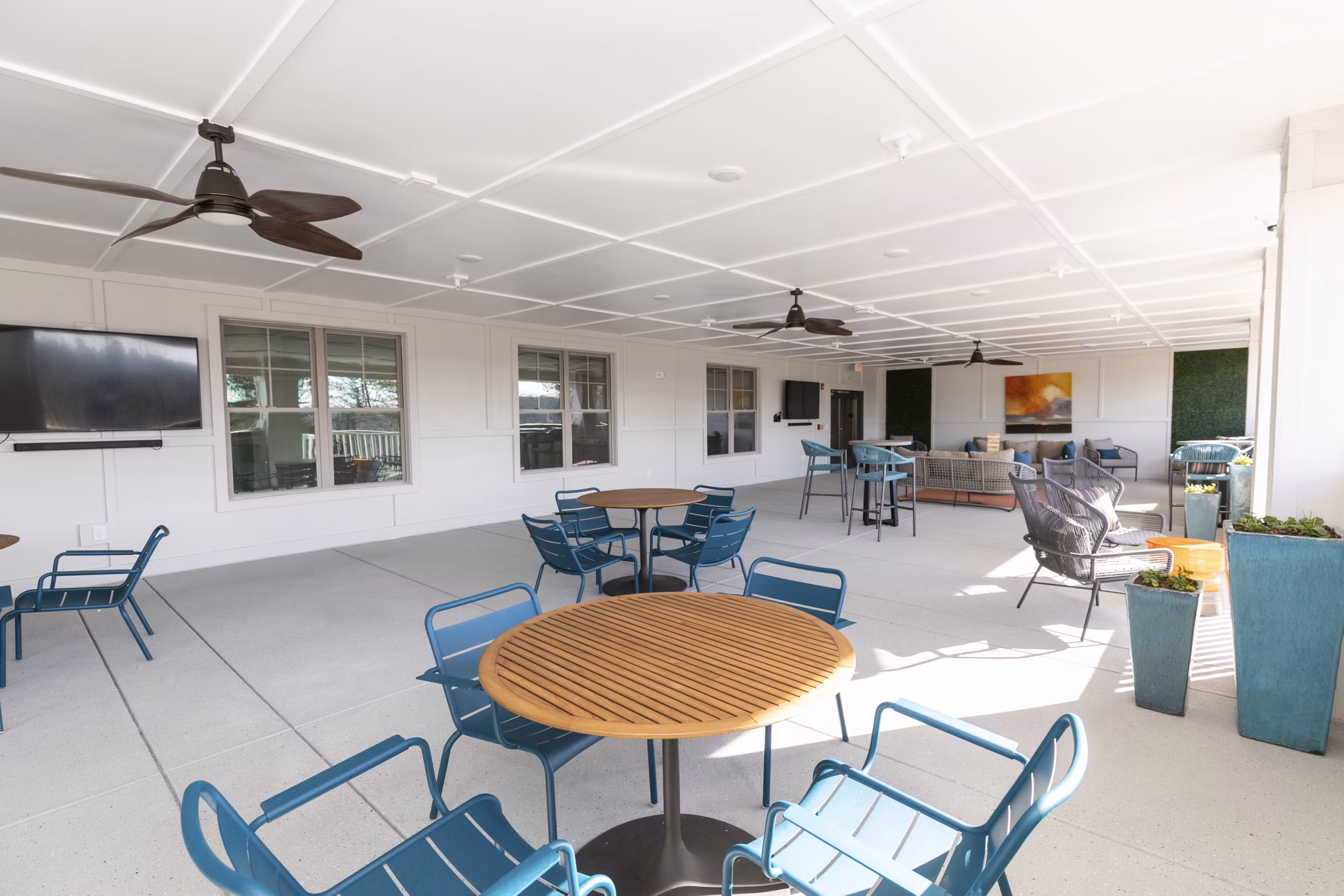 Outdoor lounge with seating on patio at Annabelle on Main Apartments, a Greystar luxury community