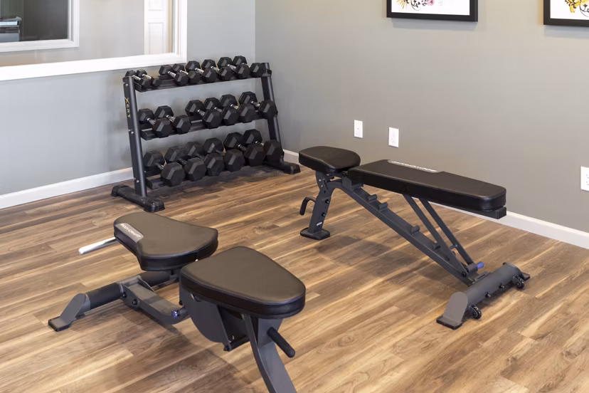 fitness center at The Ridge at Calhoun Apartments 