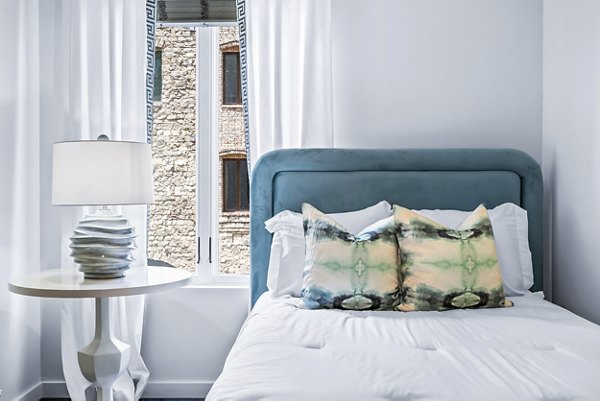 Modern bedroom with stylish decor at Avvio Apartments, a luxury living experience