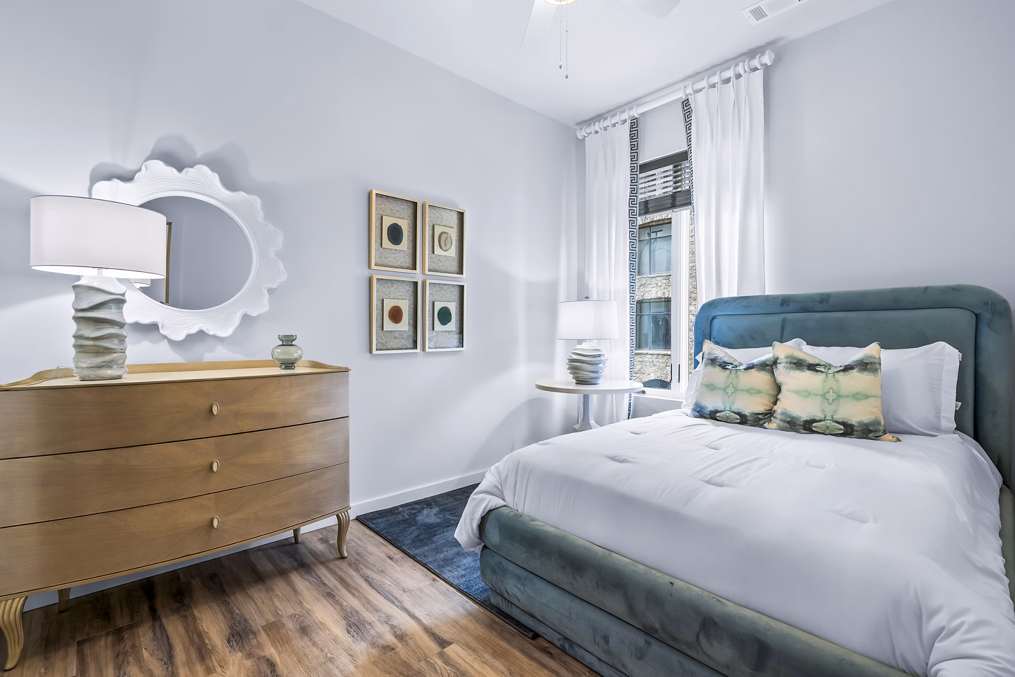 Spacious bedroom with modern decor in Avvio Apartments