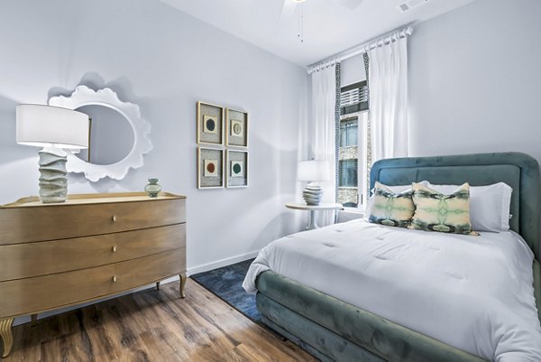 Spacious bedroom with modern decor in Avvio Apartments
