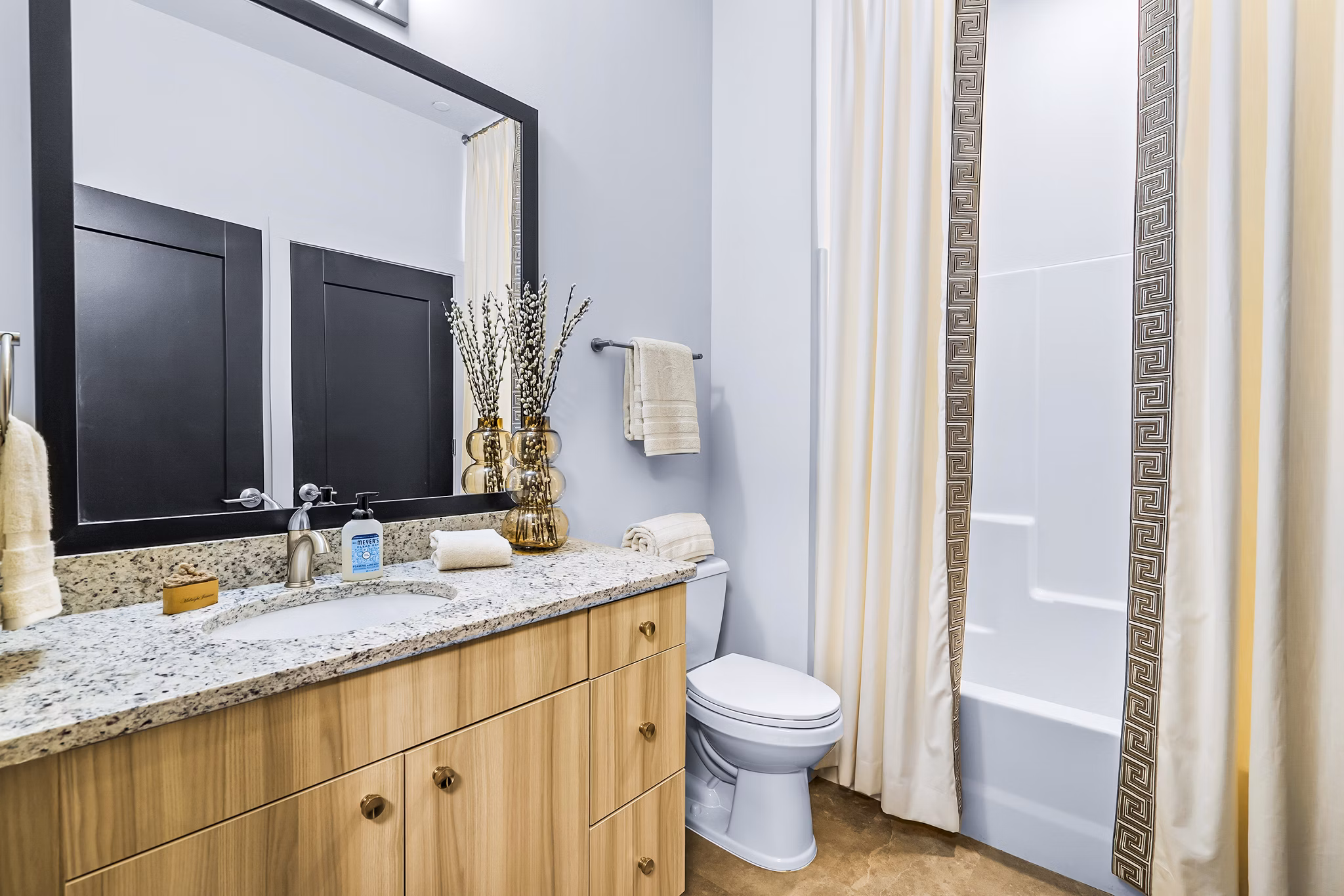 Modern bathroom with sleek fixtures at Avvio Apartments, a Greystar luxury property