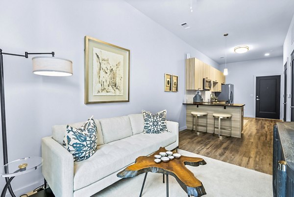 Spacious living room with modern decor in Avvio Apartments, luxury apartment living