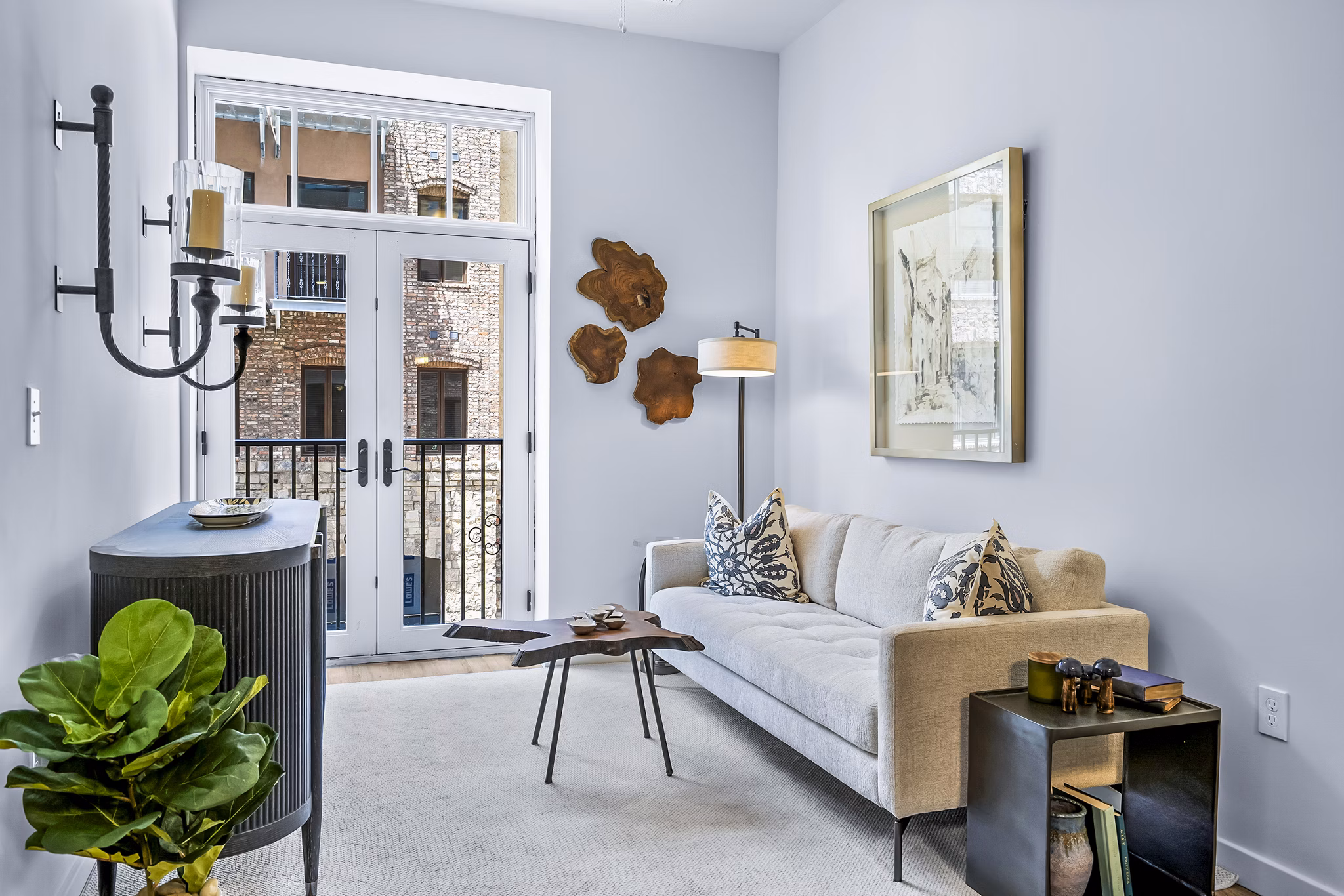 Modern living room with sleek furnishings and ample natural light at Avvio Apartments