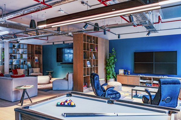 clubhouse game room at Coppermaker Square Apartments