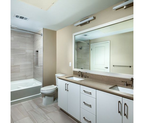 Bathroom featuring modern fixtures and sleek design at The Core on Foothill Apartments