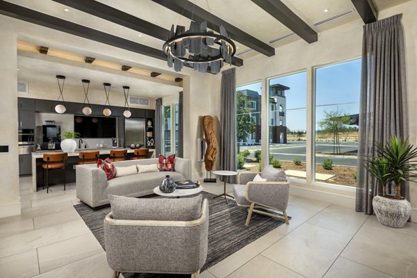 Clubhouse with modern design at The Core on Foothill Apartments featuring comfortable seating and elegant lighting
