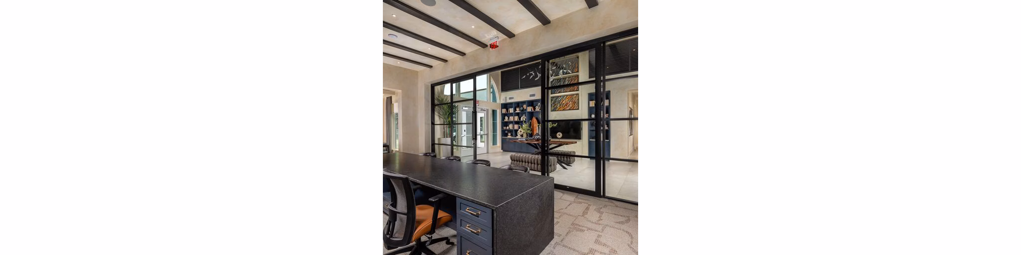 Clubhouse at The Core on Foothill Apartments featuring modern design and spacious seating areas