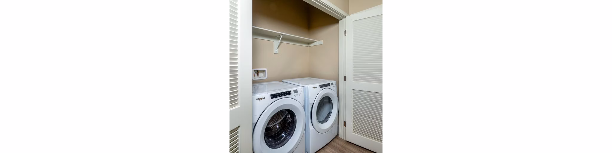 Laundry room with modern washers and dryers at The Core on Foothill Apartments