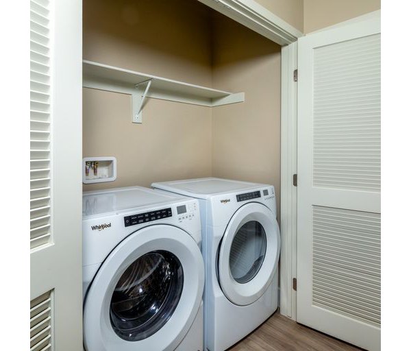 Laundry room with modern washers and dryers at The Core on Foothill Apartments