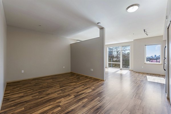 Cozy bedroom with stylish decor in Prescott Apartments: luxury living by Greystar