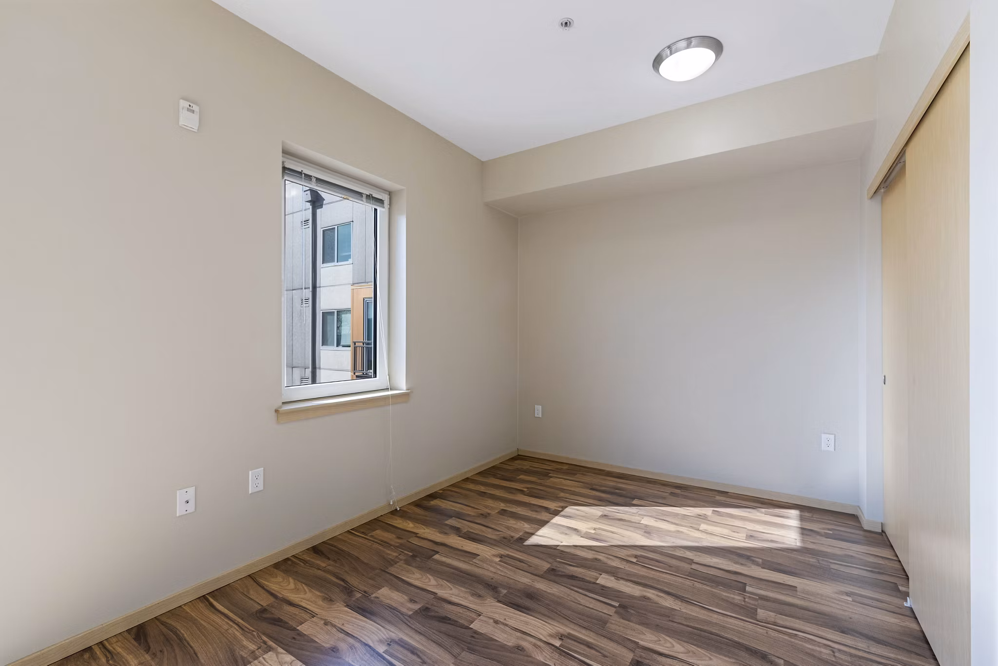 Cozy bedroom with contemporary decor at Prescott Apartments