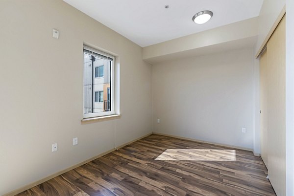 Cozy bedroom with contemporary decor at Prescott Apartments