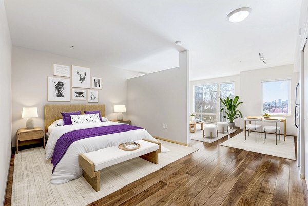 Modern bedroom with cozy design and ample natural light at Prescott Apartments
