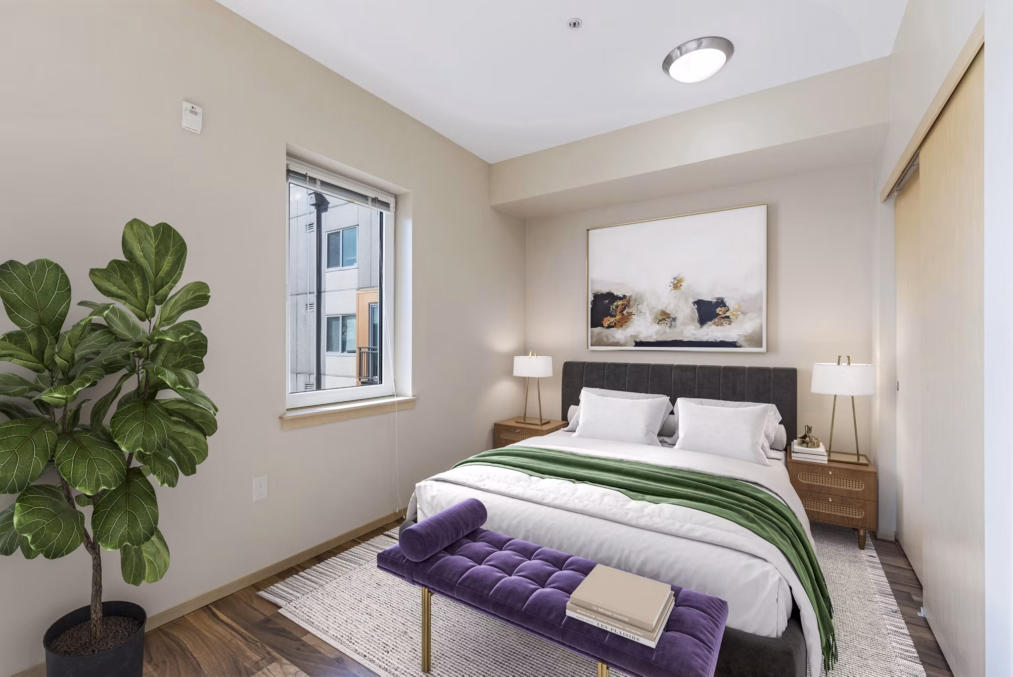 Cozy bedroom with modern furnishings in Prescott Apartments, a luxury living community by Greystar
