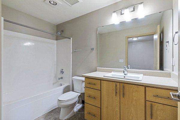 Modern bathroom with sleek fixtures at Prescott Apartments, offering luxury living in spacious Greystar-managed residences
