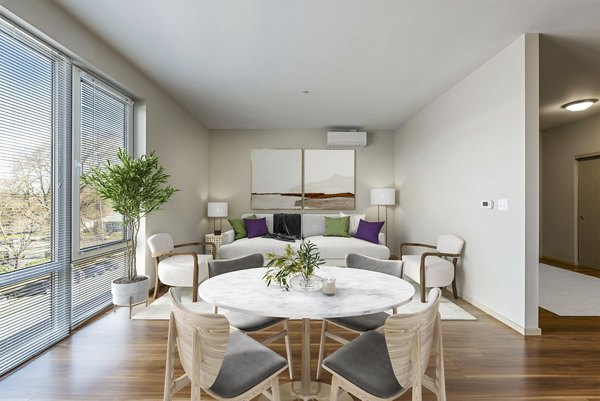 Dining and bedroom featuring modern dÃ©cor at Prescott Apartments