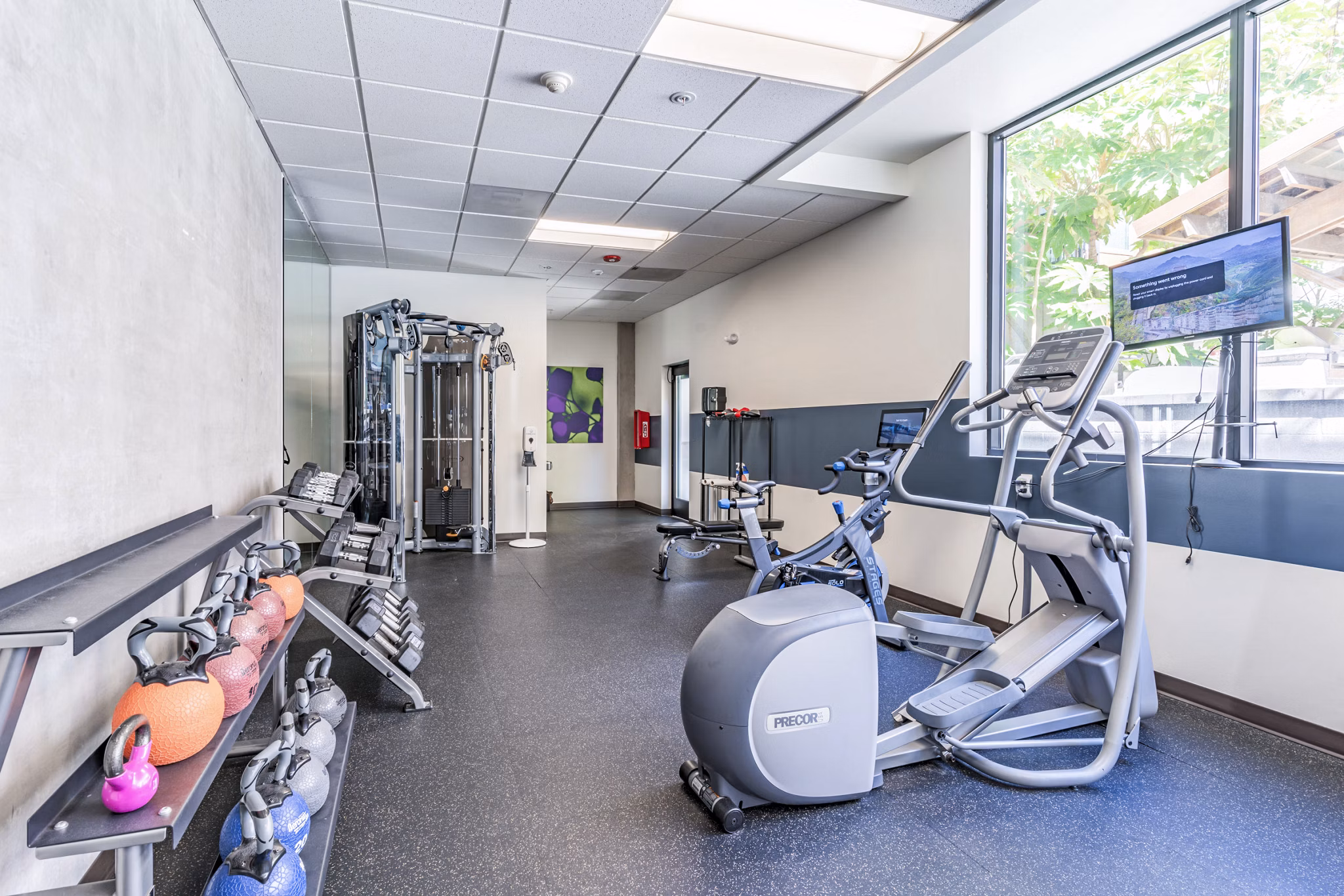 Fitness center with modern equipment at Prescott Apartments