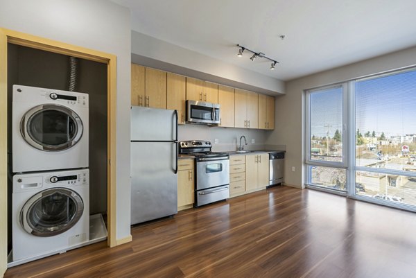 Modern kitchen with stainless steel appliances at Prescott Apartments, offering luxury living in a Greystar-managed community
