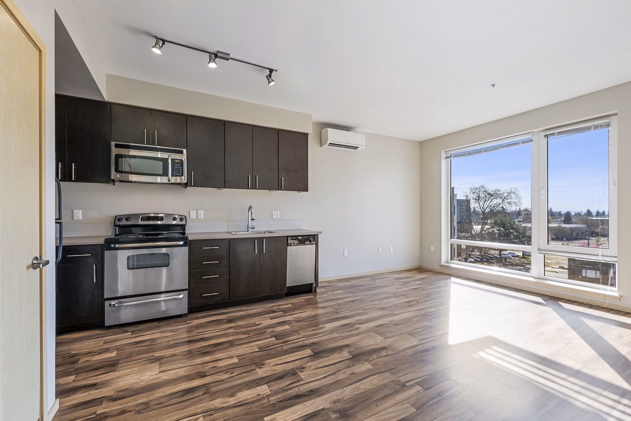 Modern kitchen with stainless steel appliances in Prescott Apartments