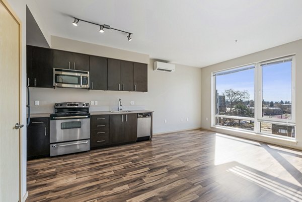 Modern kitchen with stainless steel appliances in Prescott Apartments