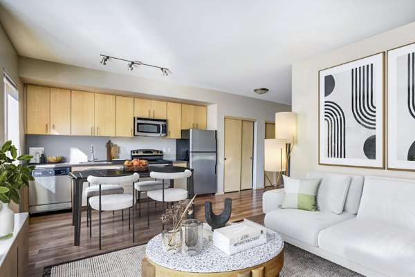 Spacious living room with modern decor at Prescott Apartments, ideal for relaxation and entertaining