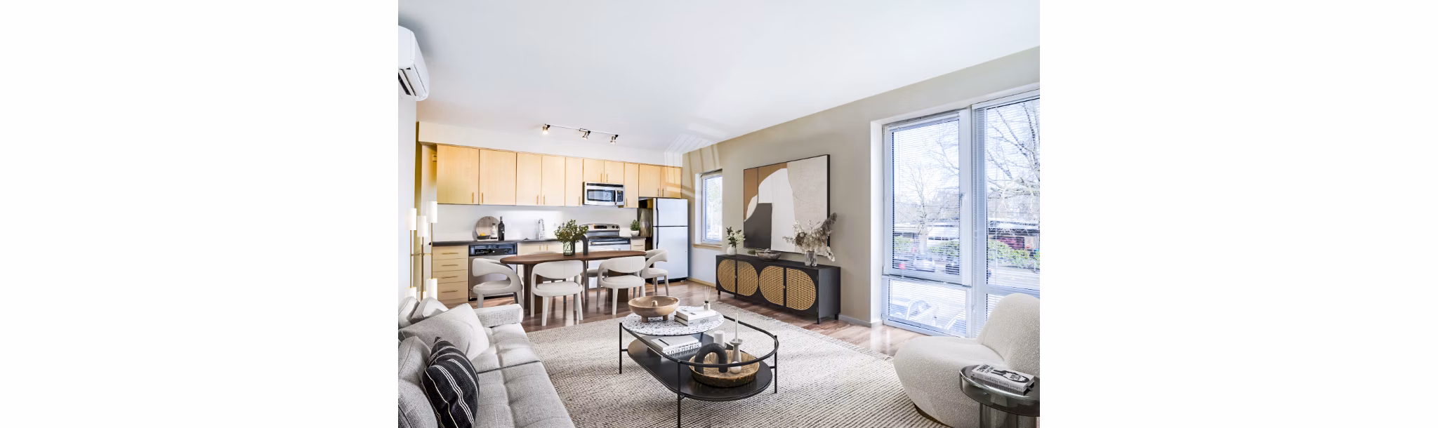 Modern living room with large windows and elegant decor at Prescott Apartments, a luxury residence