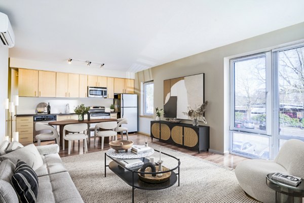 Modern living room with large windows and elegant decor at Prescott Apartments, a luxury residence