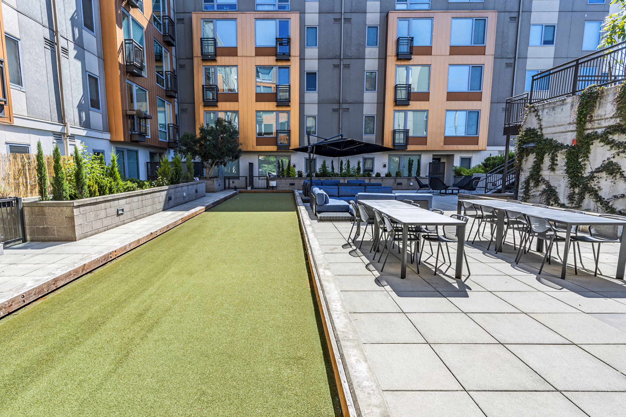 Prescott Apartments: Recreational area with green spaces and seating for relaxing and socializing