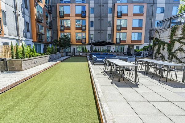 Prescott Apartments: Recreational area with green spaces and seating for relaxing and socializing