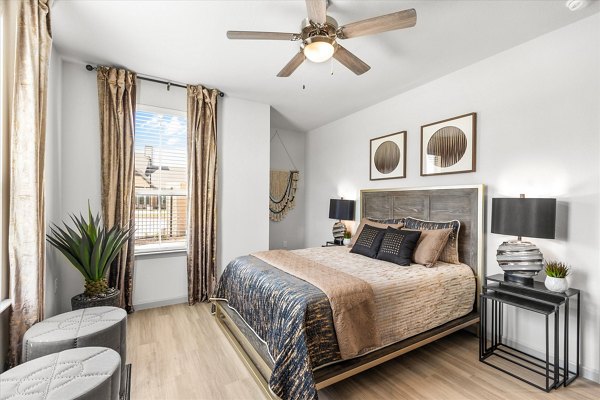 Cozy bedroom featuring modern decor at Emerson at Red Oak Apartments