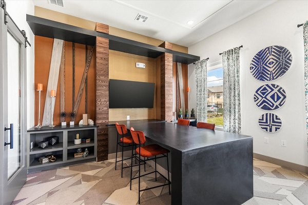 Elegant clubhouse with plush seating and modern decor at Emerson at Red Oak Apartments