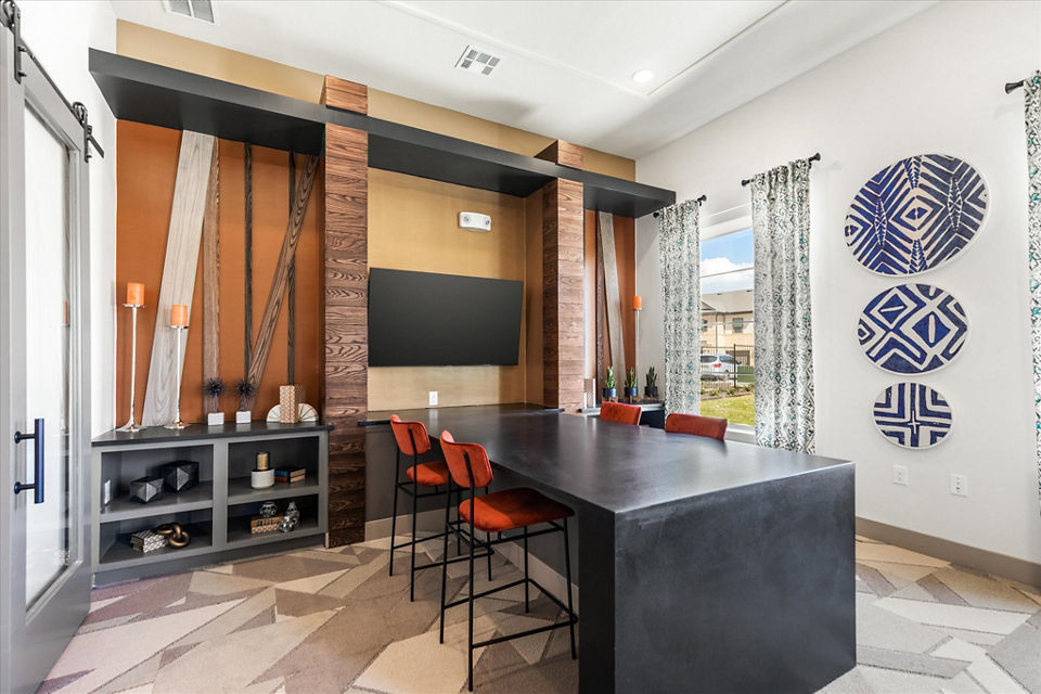 Elegant clubhouse with plush seating and modern decor at Emerson at Red Oak Apartments