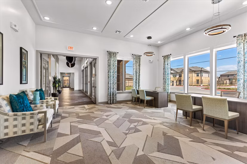 Stylish clubhouse featuring modern decor at Emerson at Red Oak Apartments